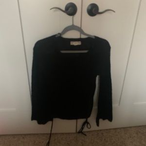 Knit black sweater with ties on the sides